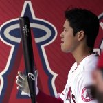 
              Los Angeles Angels' Shohei Ohtani stands in the dugout as he gets ready to bat during the first inning of a baseball game against the Toronto Blue Jays Sunday, May 29, 2022, in Anaheim, Calif. (AP Photo/Mark J. Terrill)
            