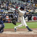 
              Milwaukee Brewers' Hunter Renfroe hits a double during the sixth inning of a baseball game against the Atlanta Braves Monday, May 16, 2022, in Milwaukee. (AP Photo/Morry Gash)
            