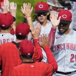 
              Cincinnati Reds' Tommy Pham (28) and TJ Friedl, top, greet teammates after a 4-0 win over the Pittsburgh Pirates in a baseball game Thursday, May 12, 2022, in Pittsburgh. (AP Photo/Keith Srakocic)
            