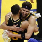 
              Golden State Warriors guard Klay Thompson, right, hugs Stephen Curry after the Warriors defeated the Dallas Mavericks in Game 5 of the NBA basketball playoffs Western Conference finals in San Francisco, Thursday, May 26, 2022. The Warriors advanced to the NBA Finals. (AP Photo/John Hefti)
            