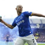 
              Everton's Richarlison tosses a flare asa he he celebrates after scoring his sides first goal during the Premier League soccer match between Everton and Chelsea at Goodison Park in Liverpool, England, Sunday, May 1, 2022. (AP Photo/Jon Super)
            