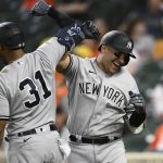 
              New York Yankees' Jose Trevino, right, celebrates his three-run home run with teammate Aaron Hicks (31) during the fourth inning of a baseball game against the Baltimore Orioles, Monday, May 16, 2022, in Baltimore. (AP Photo/Nick Wass)
            