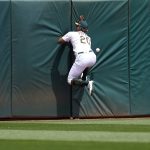 
              Oakland Athletics center fielder Cristian Pache (20) cannot catch a triple by Los Angeles Angels' Taylor Ward during the third inning of a baseball game in Oakland, Calif., Sunday, May 15, 2022. (AP Photo/Jeff Chiu)
            
