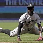 
              Chicago White Sox second baseman Josh Harrison watches his throw to first for the out on Kansas City Royals' Whit Merrifield during the seventh inning of a baseball game Thursday, May 19, 2022, in Kansas City, Mo. (AP Photo/Charlie Riedel)
            
