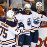 
              Edmonton Oilers defenseman Duncan Keith, center, celebrates his goal against the Calgary Flames with teammates during the first period of Game 2 of an NHL hockey Stanley Cup playoffs second-round series Friday, May 20, 2022, in Calgary, Alberta. (Jeff McIntosh/The Canadian Press via AP)
            