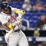 
              Atlanta Braves' Ronald Acuna Jr. hits a double during the first inning of the team's baseball game against the Miami Marlins, Friday, May 20, 2022, in Miami. (AP Photo/Lynne Sladky)
            