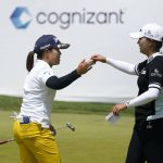 
              Nasa Hataoka, of Japan, greets Jin Young Ko, of South Korea, right, on the 18th green after finishing their first round of the LPGA Cognizant Founders Cup golf tournament, Thursday, May 12, 2022, in Clifton, N.J. (AP Photo/Seth Wenig)
            