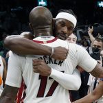 
              Miami Heat's Jimmy Butler hugs P.J. Tucker (17) after the Heat defeated the Boston Celtics 111-103 during Game 6 of the NBA basketball playoffs Eastern Conference finals Friday, May 27, 2022, in Boston. (AP Photo/Michael Dwyer)
            