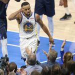 
              Golden State Warriors' Stephen Curry celebrates a basket and a Dallas Mavericks' foul during the first half of Game 3 of the NBA basketball playoffs Western Conference finals, Sunday, May 22, 2022, in Dallas. (Scott Strazzante/San Francisco Chronicle via AP)
            