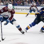 
              Colorado Avalanche's Valeri Nichushkin (13) handles the puck as St. Louis Blues' Calle Rosen (43) defends during the third period in Game 3 of an NHL hockey Stanley Cup second-round playoff series Saturday, May 21, 2022, in St. Louis. (AP Photo/Jeff Roberson)
            