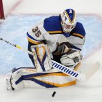 
              St. Louis Blues goaltender Ville Husso stops a Colorado Avalanche shot during the first period of Game 5 of an NHL hockey Stanley Cup second-round playoff series Wednesday, May 25, 2022, in Denver. (AP Photo/David Zalubowski)
            