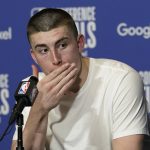 
              Boston Celtics guard Payton Pritchard (11) gestures during a post-game news conference following Game 1 of an NBA basketball Eastern Conference finals playoff series against the Miami Heat, Tuesday, May 17, 2022, in Miami. (AP Photo/Lynne Sladky)
            