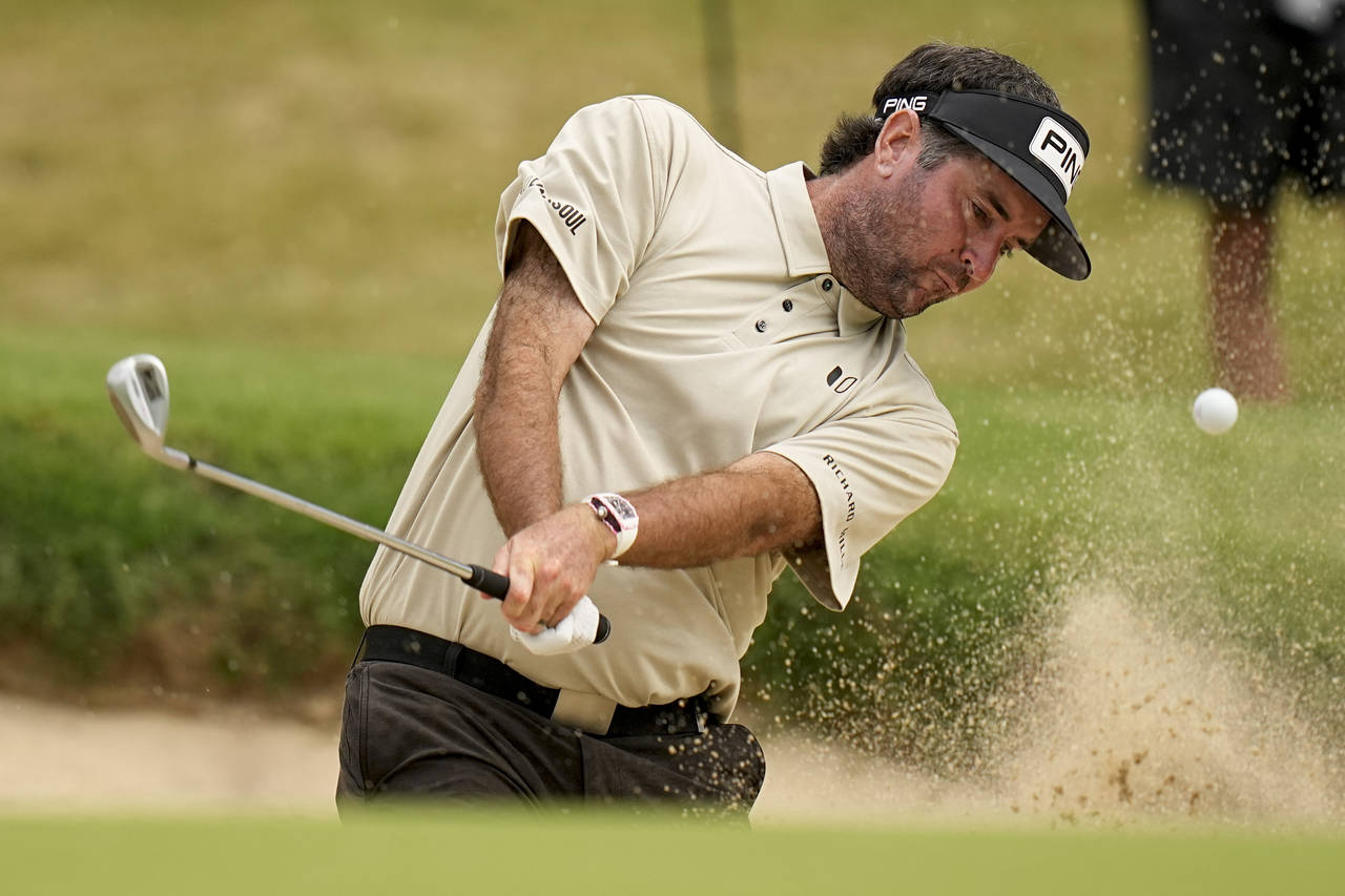 Bubba Watson hits from the bunker on the 14th hole during the second round of the PGA Championship ...