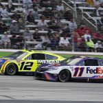 
              Denny Hamlin (11) and Ryan Blaney (12) drive during the NASCAR All-Star auto race at Texas Motor Speedway in Fort Worth, Texas, Sunday, May 22, 2022. (AP Photo/Larry Papke)
            