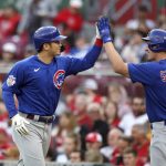 
              Chicago Cubs' Seiya Suzuki, left, celebrates with teammate Frank Schwindel after scoring against the Cincinnati Reds during the first inning of a baseball game in Cincinnati, Monday, May 23, 2022. (AP Photo/Paul Vernon)
            