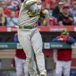 
              Oakland Athletics third baseman Sheldon Neuse throws to first get out Los Angeles Angels' Andrew Velazquez on a bunt-attempt during the first inning of a baseball game in Anaheim, Calif., Friday, May 20, 2022. (AP Photo/Alex Gallardo)
            
