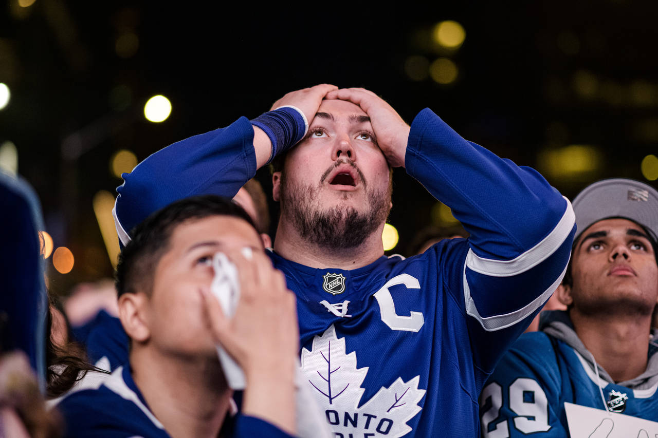 Fans react during Game 7 of an NHL hockey first-round playoff series between the Toronto Maple Leaf...