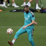 
              Real Madrid's Karim Benzema controls the ball during a Media Opening day training session in Madrid, Spain, Tuesday, May 24, 2022. Real Madrid will play Liverpool in Saturday's Champions League soccer final in Paris. (AP Photo/Manu Fernandez)
            