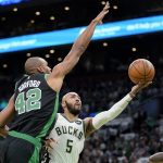 
              Boston Celtics center Al Horford (42) tries to block Milwaukee Bucks guard Jevon Carter (5) who drives toward the basket the first half of Game 1 in the second round of the NBA Eastern Conference playoff series, Sunday, May 1, 2022, in Boston. (AP Photo/Steven Senne)
            