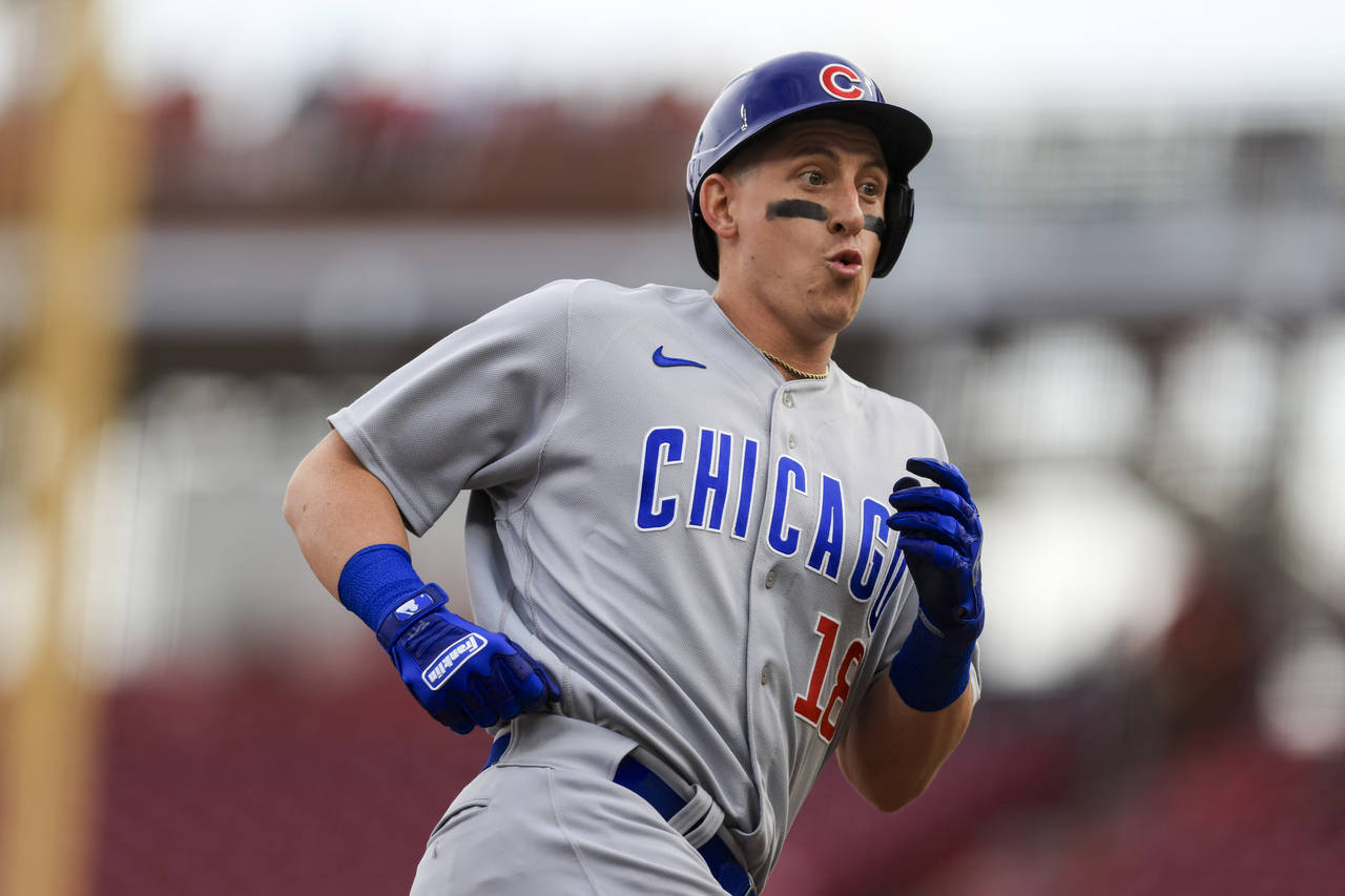 Chicago Cubs' Frank Schwindel reacts as he runs the bases after hitting a two-run home run during t...