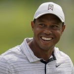 
              Tiger Woods smiles on the driving range before a practice round for the PGA Championship golf tournament, Tuesday, May 17, 2022, in Tulsa, Okla. (AP Photo/Eric Gay)
            