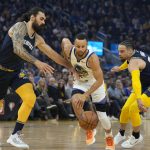 
              Golden State Warriors guard Stephen Curry, center, dribbles between Memphis Grizzlies' Steven Adams, left, and Dillon Brooks, right, during the first half of Game 4 of an NBA basketball Western Conference playoff semifinal in San Francisco, Monday, May 9, 2022. (AP Photo/Tony Avelar)
            
