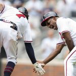 
              Atlanta Braves third base coach Ron Washington (37) slaps hands with Atlanta Braves Dansby Swanson (7) after hitting a home run during the fourth inning of a baseball game against the San Diego Padres Sunday, May 15, 2022, in Atlanta. (AP Photo/Hakim Wright Sr)
            