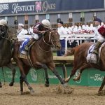 
              Rich Strike (21), with Sonny Leon aboard, leads Epicenter (3), with Joel Rosario aboard, and Zandon (10), with Flavien Prat aboard, down the straightaway to win the 148th running of the Kentucky Derby horse race at Churchill Downs Saturday, May 7, 2022, in Louisville, Ky. (AP Photo/Mark Humphrey)
            