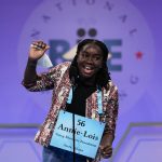 
              Annie-Lois Acheampong, 13, from Accra, Ghana, reacts during the Scripps National Spelling Bee, Tuesday, May 31, 2022, in Oxon Hill, Md. (AP Photo/Alex Brandon)
            