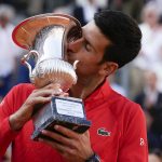 
              Serbia's Novak Djokovic kisses the trophy after winning the final match against Greece's Stefanos Tsitsipas at the Italian Open tennis tournament, in Rome, Sunday, May 15, 2022. (AP Photo/Alessandra Tarantino)
            