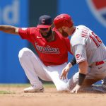 
              Cleveland Guardians' Amed Rosario tags out Cincinnati Reds' Colin Moran (16) for the second out of a double play on a ball hit by Kyle Farmer during the fifth inning of a baseball game, Thursday, May 19, 2022, in Cleveland. (AP Photo/Ron Schwane)
            