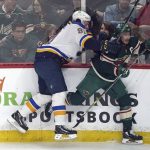 
              St. Louis Blues' Vladimir Tarasenko, left, checks Minnesota Wild's Jared Spurgeon into the boards during the first period of Game 2 of an NHL hockey Stanley Cup first-round playoff series Wednesday, May 4, 2022, in St. Paul, Minn. (AP Photo/Jim Mone)
            