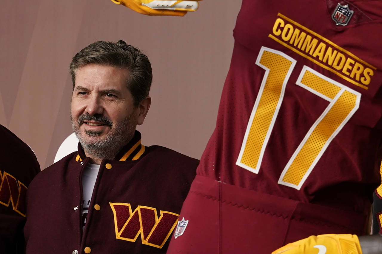 FILE - Dan Snyder, co-owner and co-CEO of the Washington Commanders, poses for photos during an eve...