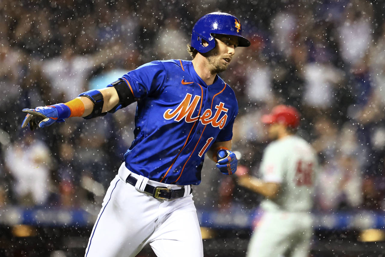 New York Mets' Jeff McNeil runs the bases after hitting a three-run home run against the Philadelph...