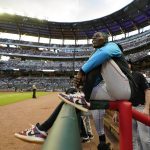 
              Miami Marlins second baseman Jazz Chisholm Jr. watches from the dugout railing between innings of the team's baseball game against Atlanta Braves on Friday, May 27, 2022, in Atlanta. Chisholm was not in the starting lineup. (AP Photo/John Bazemore)
            