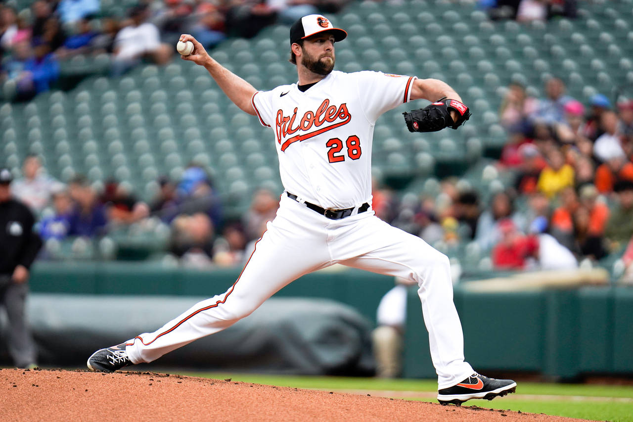 Baltimore Orioles starting pitcher Jordan Lyles throws during the first inning of a baseball game a...