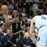 
              Golden State Warriors' Draymond Green (23) looks to pass as Memphis Grizzlies' Steven Adams (4) moves in during the first half of Game 5 of an NBA basketball second-round playoff series Wednesday, May 11, 2022, in Memphis, Tenn. (AP Photo/Karen Pulfer Focht)
            