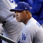 
              Los Angeles Dodgers manager Dave Roberts watches play during the second inning of a baseball game against the Arizona Diamondbacks, Saturday, May 28, 2022, in Phoenix. (AP Photo/Matt York)
            