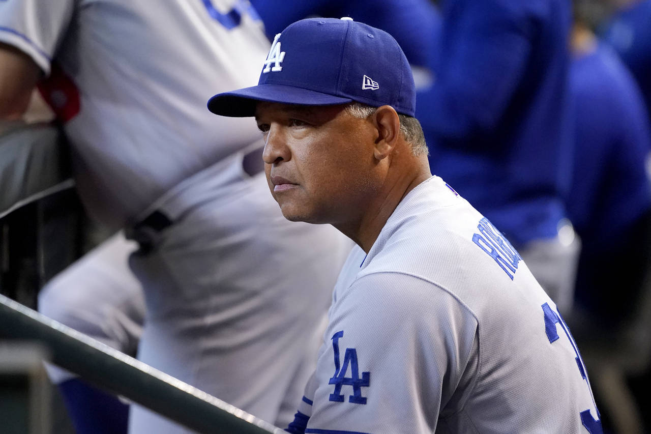 Los Angeles Dodgers manager Dave Roberts watches play during the second inning of a baseball game a...