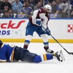 
              Colorado Avalanche's Nazem Kadri (91) handles the puck as St. Louis Blues' Nick Leddy defends during the first period in Game 6 of an NHL hockey Stanley Cup second-round playoff series Friday, May 27, 2022, in St. Louis. (AP Photo/Jeff Roberson)
            
