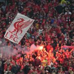 
              Liverpool fans light flares prior to the start of the Champions League final soccer match between Liverpool and Real Madrid at the Stade de France in Saint Denis near Paris, Saturday, May 28, 2022. (AP Photo/Kirsty Wigglesworth)
            