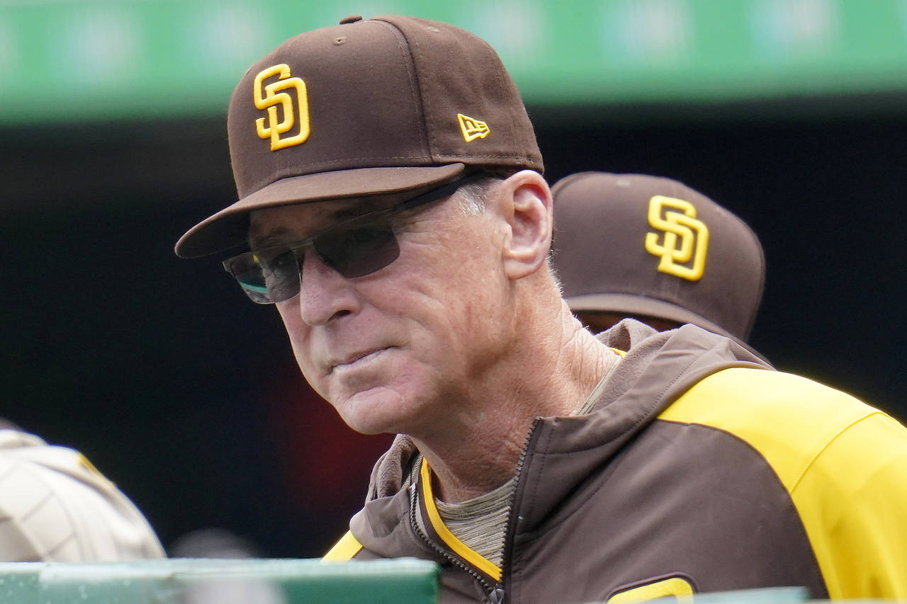 FILE - San Diego Padres manager Bob Melvin stands in the dugout during the first inning of a baseba...