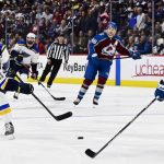 
              St. Louis Blues center Tyler Bozak, left, shoots past Colorado Avalanche center Nazem Kadri to score in overtime of Game 5 of an NHL hockey second-round playoff series Wednesday, May 25, 2022, in Denver. (Andy Cross/The Denver Post via AP)
            
