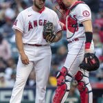 
              Los Angeles Angels catcher Chad Wallach, right, has a discussion with starting pitcher Chase Silseth during the first inning of a baseball game against the Oakland Athletics in Anaheim, Calif., Friday, May 20, 2022. (AP Photo/Alex Gallardo)
            