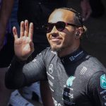 
              Mercedes driver Lewis Hamilton of Britain waves as he leaves his motorhome prior to the start of the third practice session at the Barcelona Catalunya racetrack in Montmelo, Spain, Saturday, May 21, 2022. The Formula One race will be held on Sunday. (AP Photo/Manu Fernandez)
            