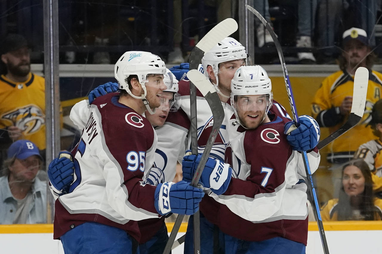 Colorado Avalanche players celebrate after a goal by Valeri Nichushkin (13) during the third period...