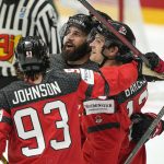 
              Canada's Eric O'Dell , center, is celebrated after he scored the 4th goal during the group A Hockey World Championship match between Canada and France in Helsinki, Finland, Tuesday May 24 2022. (AP Photo/Martin Meissner)
            
