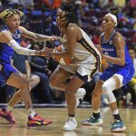 
              Indiana Fever guard Kelsey Mitchell (0) drives between Connecticut Sun guards Natisha Hiedeman (2) and Jasmine Thomas (5)during a WNBA basketball game Friday, May 20, 2022, in Uncasville, Conn. (Sean D. Elliot/The Day via AP)
            