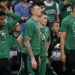 
              The Boston Celtics bench watches play during the second half of Game 6 of the team's NBA basketball playoffs Eastern Conference finals against the Miami Heat, Friday, May 27, 2022, in Boston. (AP Photo/Michael Dwyer)
            