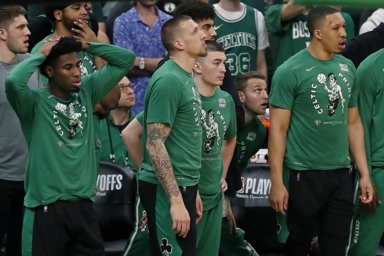 The Boston Celtics bench watches play during the second half of Game 6 of the team's NBA basketball...